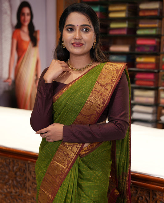 Olive Green Chettinad Cotton Saree, Gleamed Up Checked Design All Over Its Body, Complemented by a Contrast Traditional Zari Border of Peacock Designs, Zari-Striped Pallu, and Has No Blouse