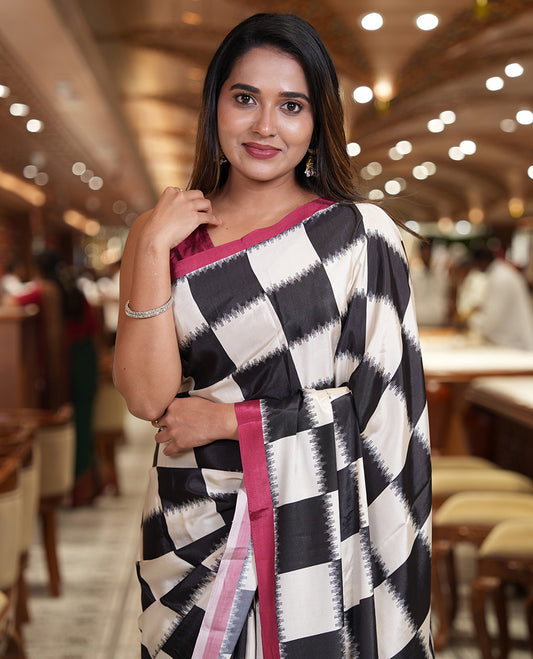 Cream and Black Satin Crepe Saree, Highlighted with Chess-Style Checked Design in Ikkat Weave, Complemented by a Contrast Border, Ikkat Chevron Printed Pallu, and Paired with a Contrast Blouse