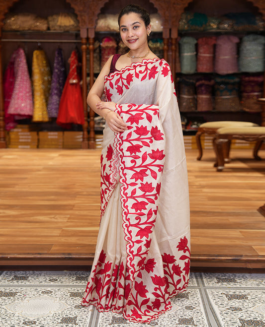 Cream and Red Plain Fancy Kota Silk Saree Simply Sparkled with Lotus Floral Applique Embroidered Scallop Border, Lotus Motifs Applique Embroidered Pallu, and a Contrast Plain Blouse