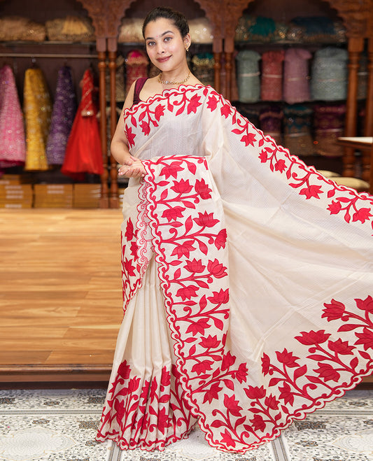 Cream and Red Plain Fancy Kota Silk Saree Simply Sparkled with Lotus Floral Applique Embroidered Scallop Border, Lotus Motifs Applique Embroidered Pallu, and a Contrast Plain Blouse