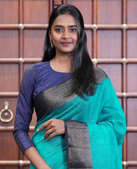 Blue Plain Jute Linen Saree, Complemented by a Contrast Hazily Woven Border of Traditional Designs, Subtly Striped Pallu, and Paired with a Contrast Blouse