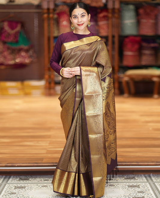 Coffee Brown Kanchipuram Budget Silk Saree Richly Detailed with Jacquard Design, Highlighted by Zari Border of Floral and Jaal Designs, Pallu Embellished with Big Paisley Designs, and Paired with a Matching Blouse