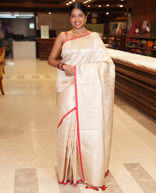 Off-White-Red Semi-Silk Saree, Adorned with Floral Jacquard Design, a Zari Paisley Border, and a Contrast Blouse