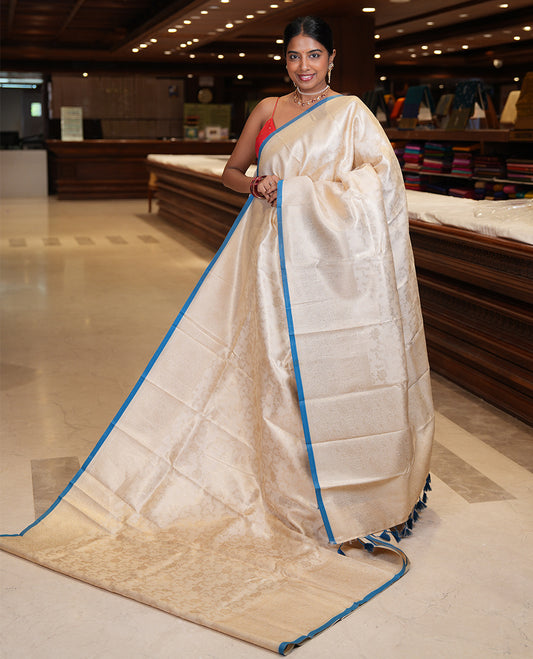 Off-White-Peacock Blue Semi-Silk Saree, Adorned with Floral Jacquard Design, a Zari Paisley Border, and a Contrast Blouse