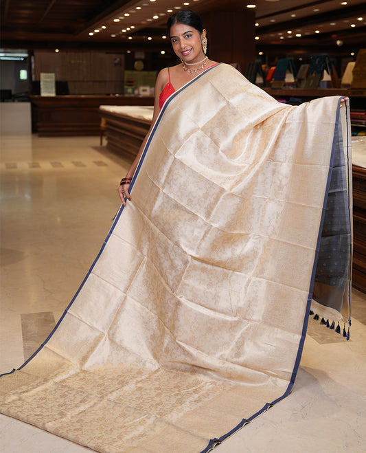 Off-White-Navy Semi-Silk Saree, Adorned with Floral Jacquard Design, a Zari Paisley Border, and a Contrast Blouse