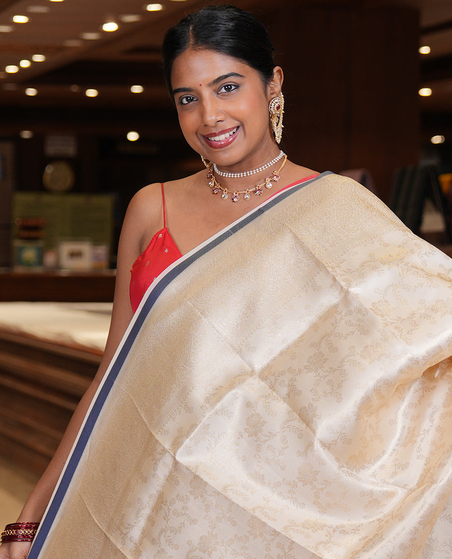 Off-White-Navy Semi-Silk Saree, Adorned with Floral Jacquard Design, a Zari Paisley Border, and a Contrast Blouse