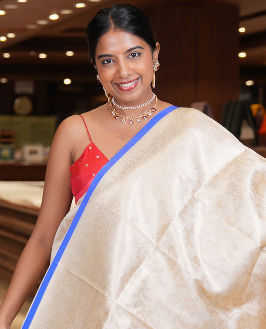 Off-White-M.s Blue Semi-Silk Saree, Adorned with Floral Jacquard Design, a Zari Paisley Border, and a Contrast Blouse