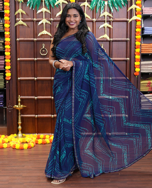 Navy Blue Georgette Saree Adorned with Zig-Zag Shibori-Style Patterns Printed All Over Its Body, Piping Lace Border, Pallu of Shibori Print, and Paired with a Matching Blouse