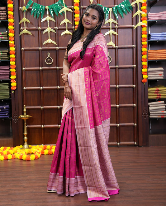 Rani Pink Kanchi Silk Saree Enriched with Butta Enclosed Checks All Over Its Body, Complemented by Contrast Traditional Zari Design Border, Gracefully Embellished Pallu, and Paired with a Contrast Brocade Blouse