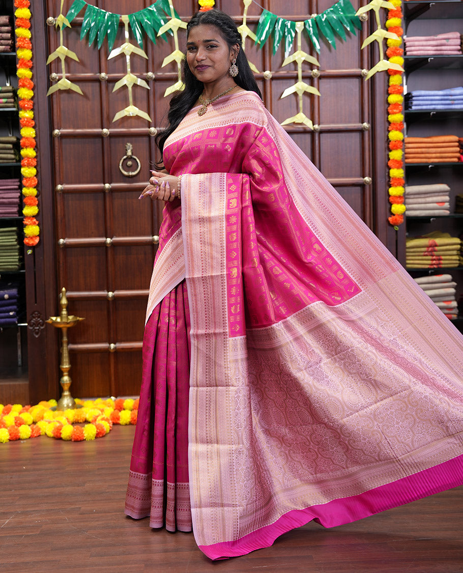 Rani Pink Kanchi Silk Saree Enriched with Butta Enclosed Checks All Over Its Body, Complemented by Contrast Traditional Zari Design Border, Gracefully Embellished Pallu, and Paired with a Contrast Brocade Blouse