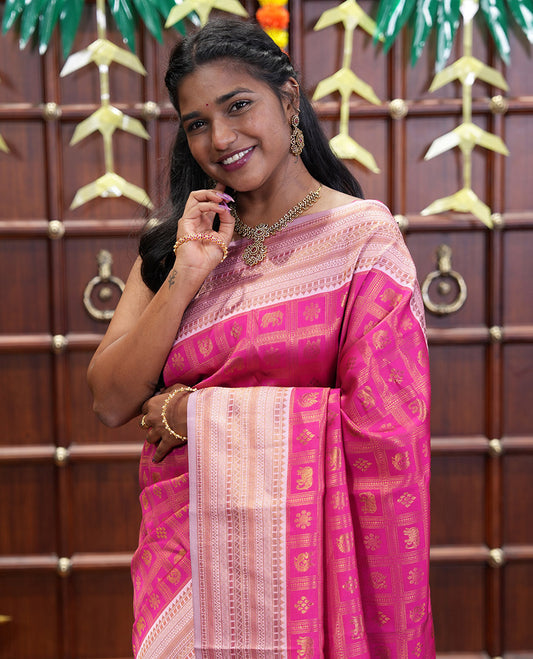 Rani Pink Kanchi Silk Saree Enriched with Butta Enclosed Checks All Over Its Body, Complemented by Contrast Traditional Zari Design Border, Gracefully Embellished Pallu, and Paired with a Contrast Brocade Blouse