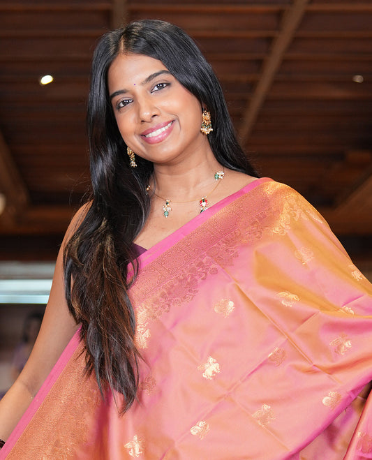 Onion Pink Soft Silk Saree, Adorned with Horse-Peacock Buttas, a Zari Border, Jaal Pallu, and a Matching Blouse