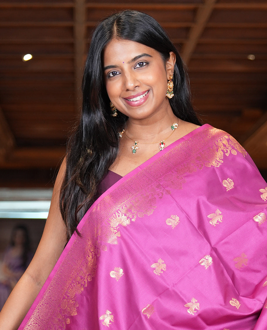 Magenta Soft Silk Saree, Decorated with Horse-Peacock Buttas, a Zari Border, Jaal Pallu, and a Matching Blouse