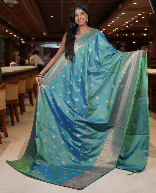 Peacock Blue Soft Silk Saree, Ornamented with Horse-Peacock Buttas, a Zari Border, Jaal Pallu, and a Matching Blouse