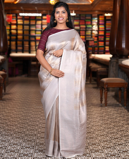 Cream Elite Soft Silk Saree, Gleamed up with Jacquard Design, Highlighted by Traditional Zari Border, Grand Pallu and a Matching Blouse