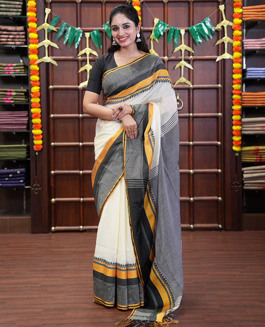 Cream-Black Plain Khadi Mul Cotton Saree, Complemented by a Contrast Thread-Woven Border of Geometric Patterns, Contrast Plain Pallu, and Paired with a Matching Blouse