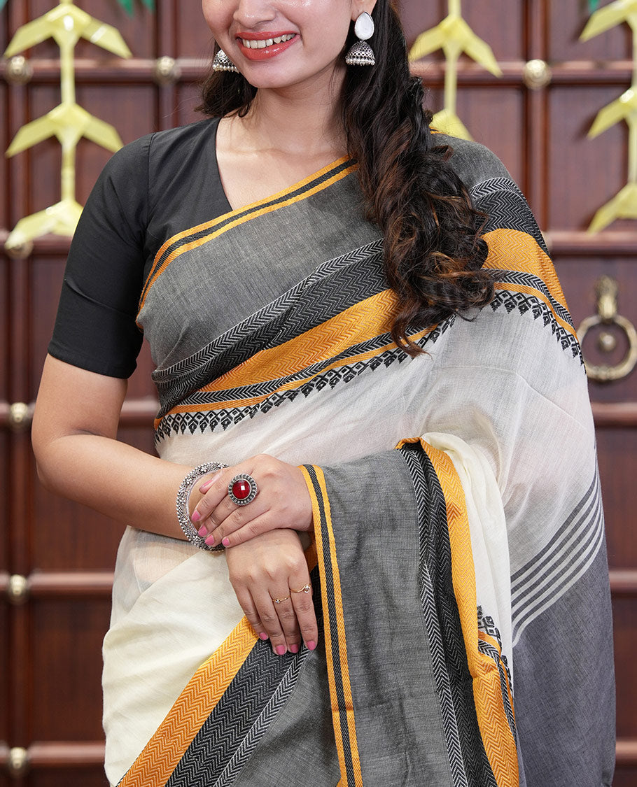 Cream-Black Plain Khadi Mul Cotton Saree, Complemented by a Contrast Thread-Woven Border of Geometric Patterns, Contrast Plain Pallu, and Paired with a Matching Blouse