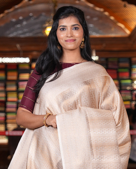Cream Elite Soft Silk Saree, Enriched with Jacquard Design, Highlighted by Traditional Zari Border, Grand Pallu and a Matching Blouse