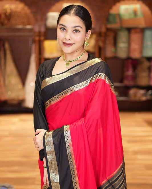 Red and Black Plain Semi-Mysore Silk Saree, Complemented by a Contrast Rettai Pettu Traditional Zari Border of Diamond Designs, Pallu Steeped with Gleaming Zari Stripes, and Paired with a Contrast Blouse