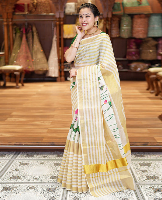 Cream Kerala Cotton Saree, Gleamed Up with Horizontal Zari Stripes and Pichwai Lotus Print All Over Its Body, Subtle Zari Border, Pallu Mirrors Pichwai Lotus Print, and Paired with a Matching Blouse