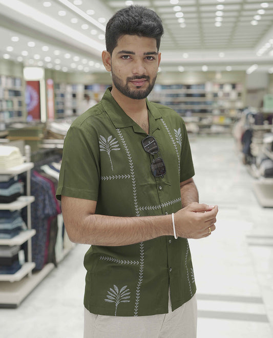 Dark Green Cotton-Blended Casual Shirt, Subtle Sparkled with Contemporary Prints, Comes with a Cuban Collar, Half-Sleeves, Regular Fit, and Regular Length