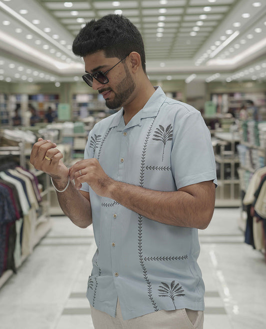 Light Blue Cotton-Blended Casual Shirt, Subtle Sparkled with Contemporary Prints, Comes with a Cuban Collar, Half-Sleeves, Regular Fit, and Regular Length