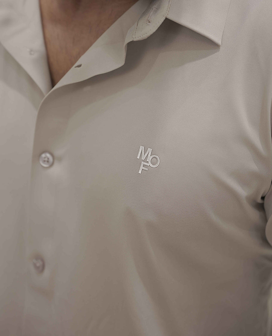 Khaki Plain Poly Lycra Blended Casual Shirt, Comes with a Spread Collar, Stitchless Half-Sleeves, Slim Fit, and Regular Length