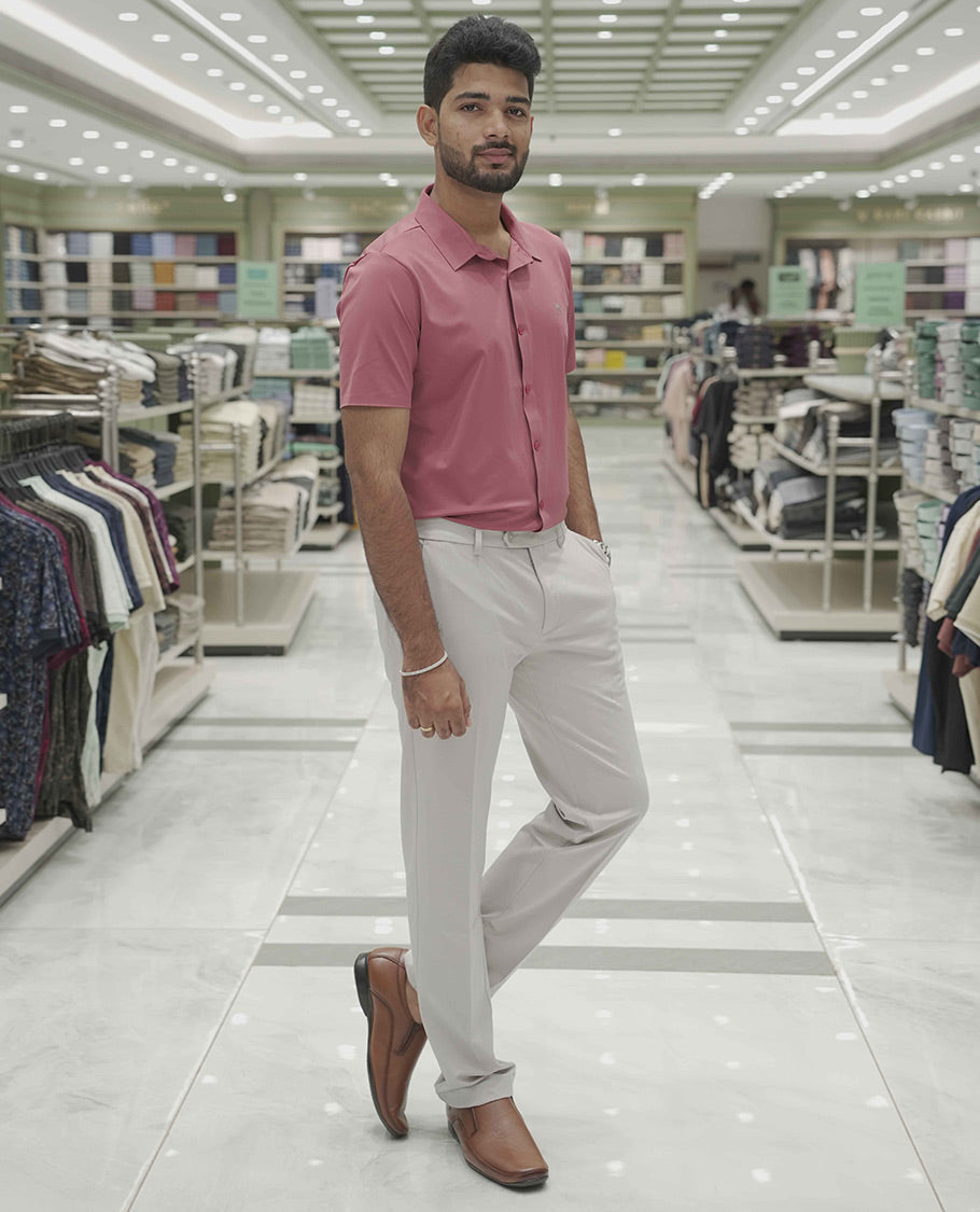 Pink Plain Poly Lycra Blended Casual Shirt, Comes with a Spread Collar, Stitchless Half-Sleeves, Slim Fit, and Regular Length