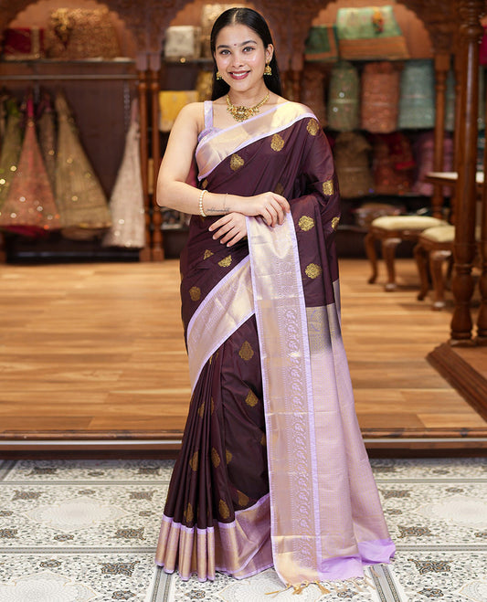 Brown Kanchipuram Budget Silk Saree, Embellished with Zari Buttas All Over Its Body, Complemented by a Contrast Traditional Zari Design Border, Masterfully Woven Pallu of Jaal Designs, and Paired with a Matching Blouse