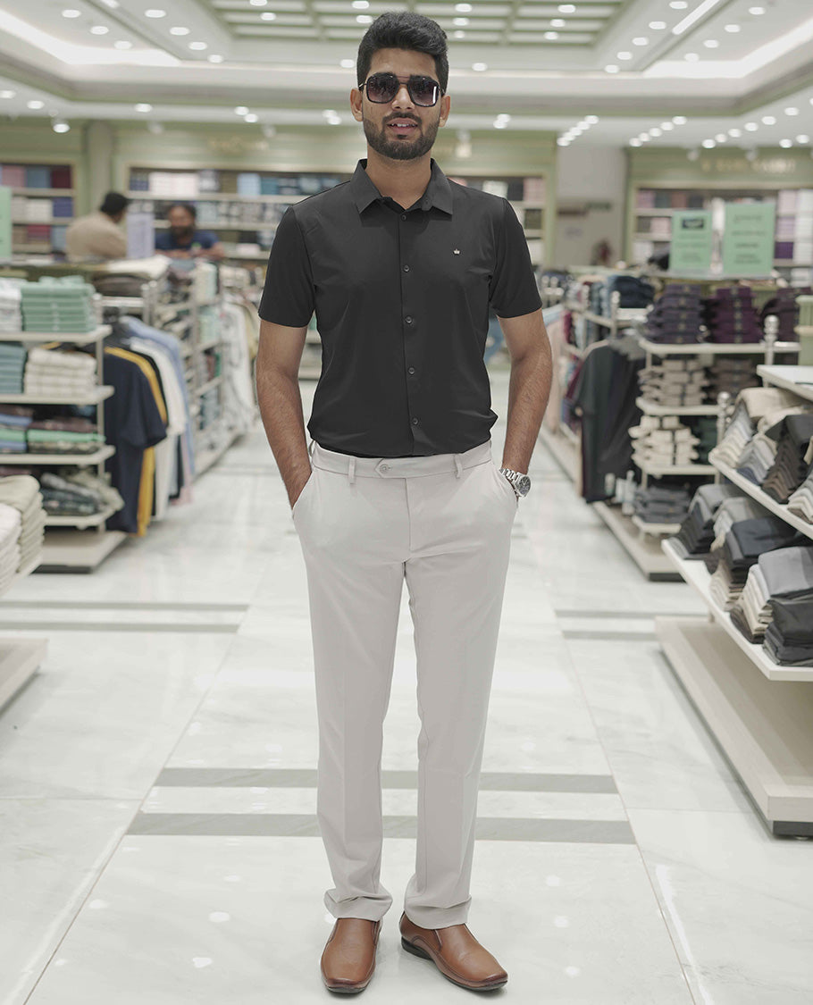 Black Plain Poly Lycra Blended Casual Shirt, Comes with a Spread Collar, Stitchless Half-Sleeves, Slim Fit, and Regular Length