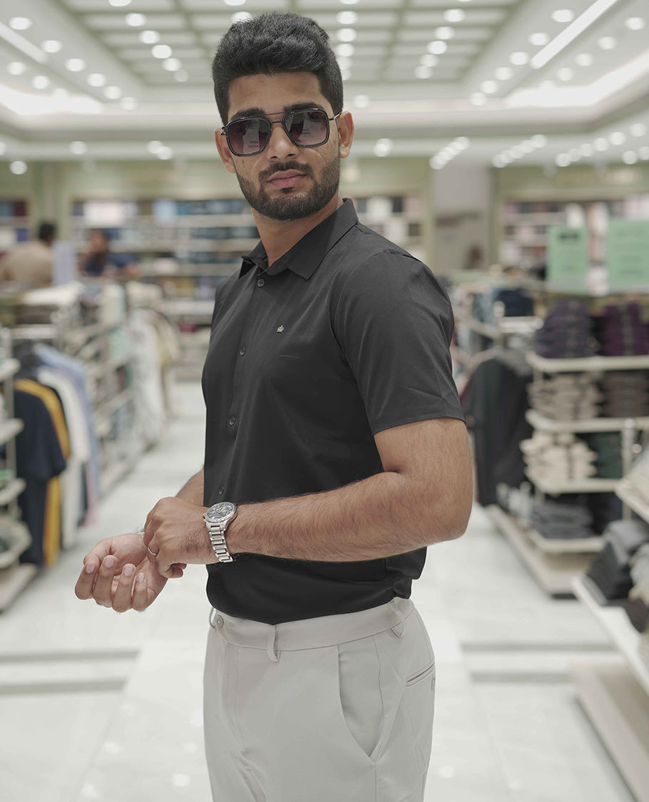 Black Plain Poly Lycra Blended Casual Shirt, Comes with a Spread Collar, Stitchless Half-Sleeves, Slim Fit, and Regular Length