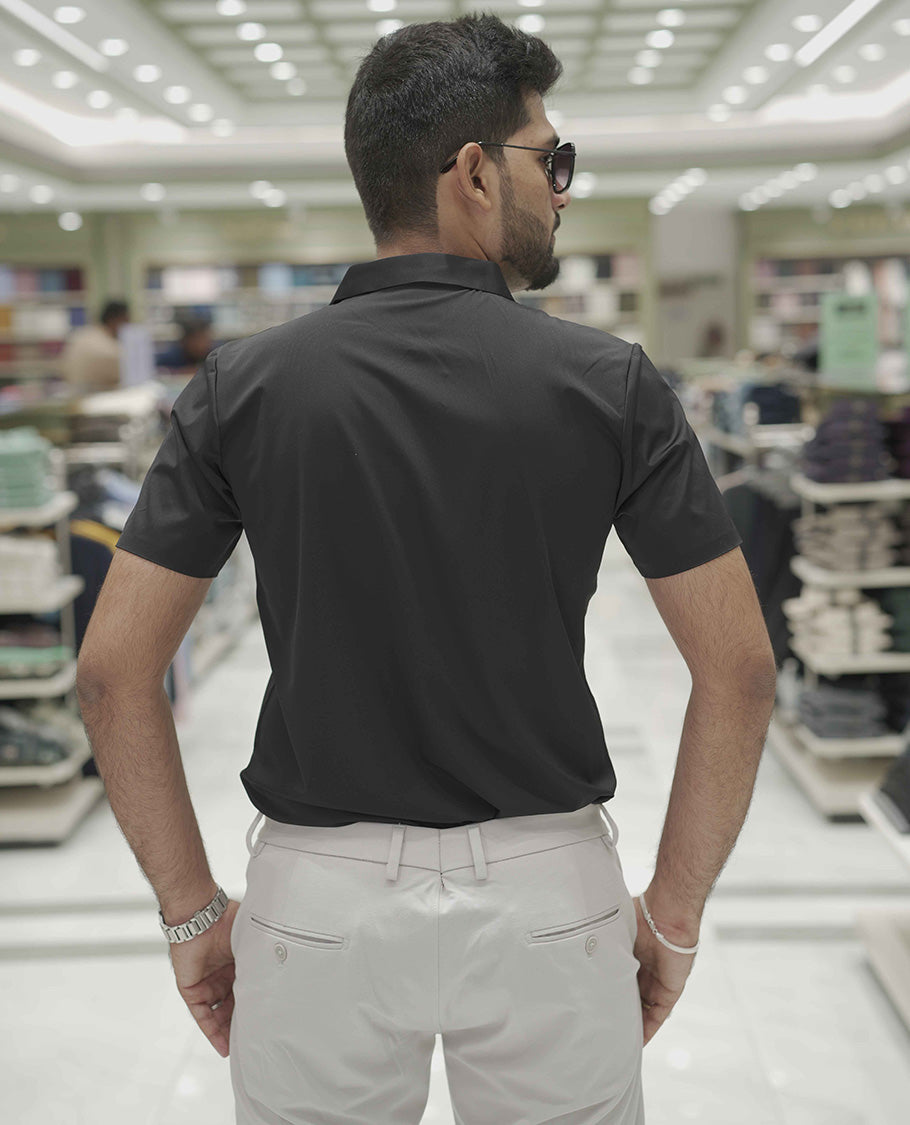 Black Plain Poly Lycra Blended Casual Shirt, Comes with a Spread Collar, Stitchless Half-Sleeves, Slim Fit, and Regular Length
