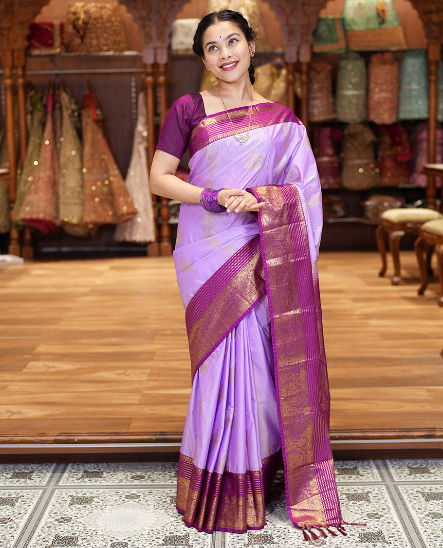 Lavender Kanchipuram Budget Silk Saree, Accentuated with Zari Buttas and Zari Stripes All Over Its Body, Complemented by a Contrast Traditional Zari Design Border, Zari-Rich Jaal Pallu, and Paired with a Contrast Blouse