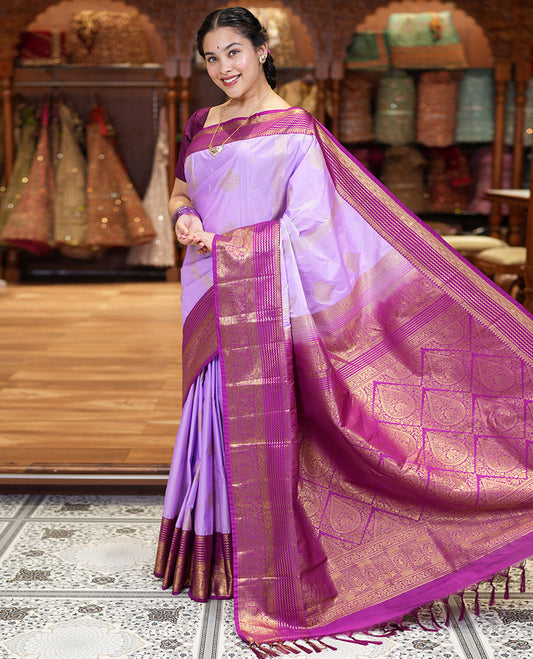 Lavender Kanchipuram Budget Silk Saree, Accentuated with Zari Buttas and Zari Stripes All Over Its Body, Complemented by a Contrast Traditional Zari Design Border, Zari-Rich Jaal Pallu, and Paired with a Contrast Blouse
