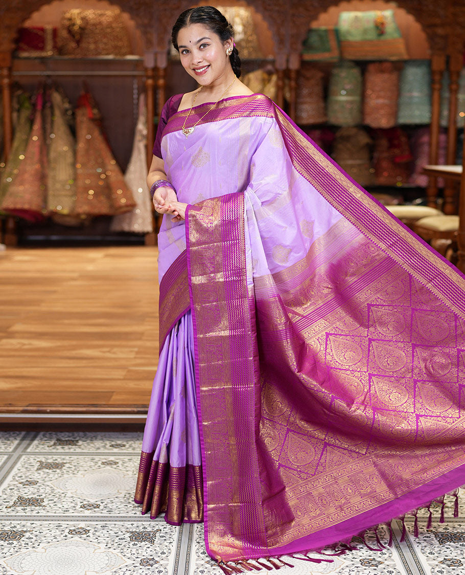 Lavender Kanchipuram Budget Silk Saree, Accentuated with Zari Buttas and Zari Stripes All Over Its Body, Complemented by a Contrast Traditional Zari Design Border, Zari-Rich Jaal Pallu, and Paired with a Contrast Blouse