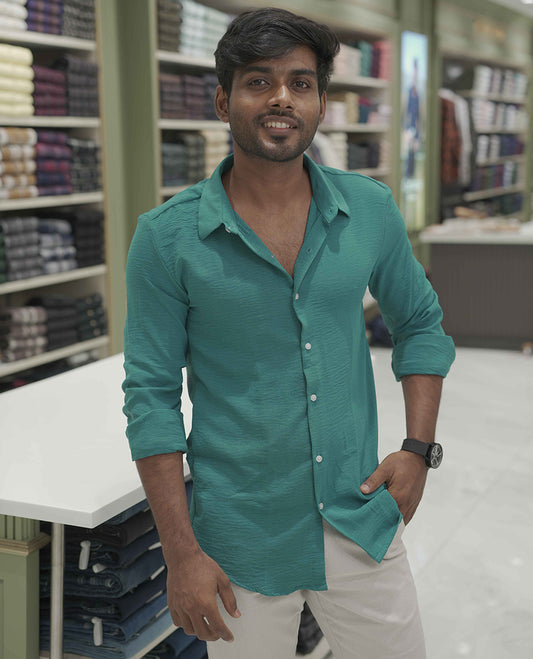 Teal Plain Poly-Blend Casual Shirt, Comes with a Spread Collar, Full-Sleeves, Slim Fit, and Regular Length