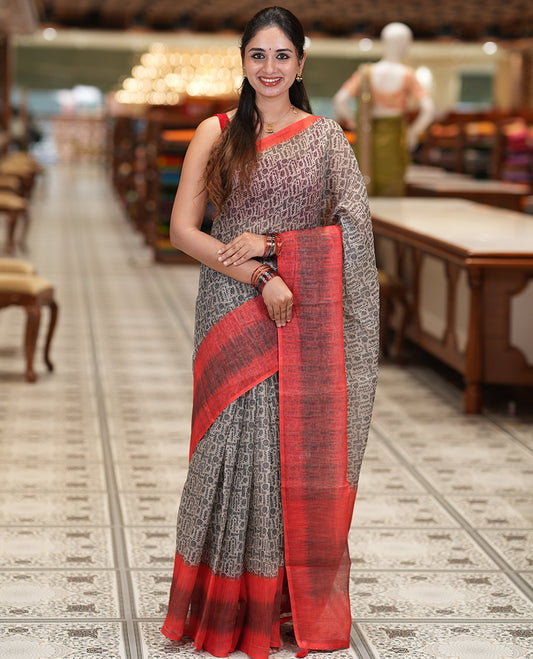 Chikku-Orange Linen Cotton Saree, Ornamented with Intricate Print, a Contrast Ikat Border, Printed Pallu, and Contrast Blouse