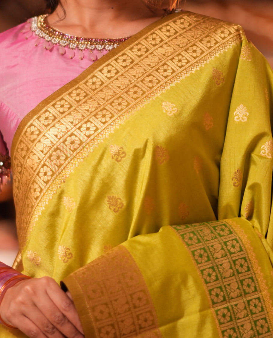 Parrot Green Fancy Raw Silk Saree, Subtly Woven with Buttas, Peacock-Flower Traditional Border, and a Matching Blouse