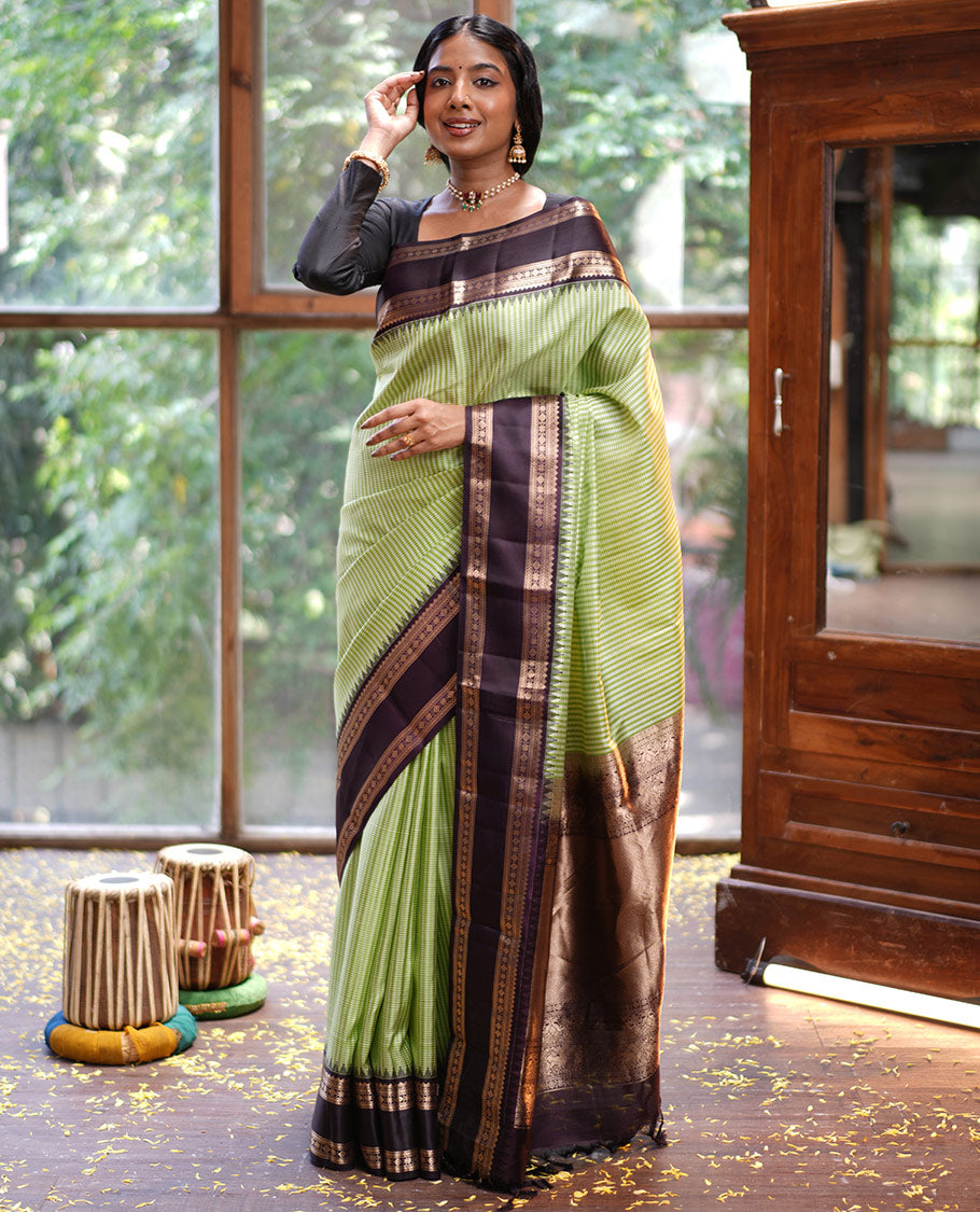 Green Vasundhara Silk Saree, Adorned with Kasa-Kasa-Style Checks, Complemented by a Contrast Rettai Pettu Border of Thazampoo Rekku, Salngai, Banaras, Kathir, Kamalam, and Star Designs, Gleaming Zari-Decked-Up Pallu and Paired with a Contrast Blouse