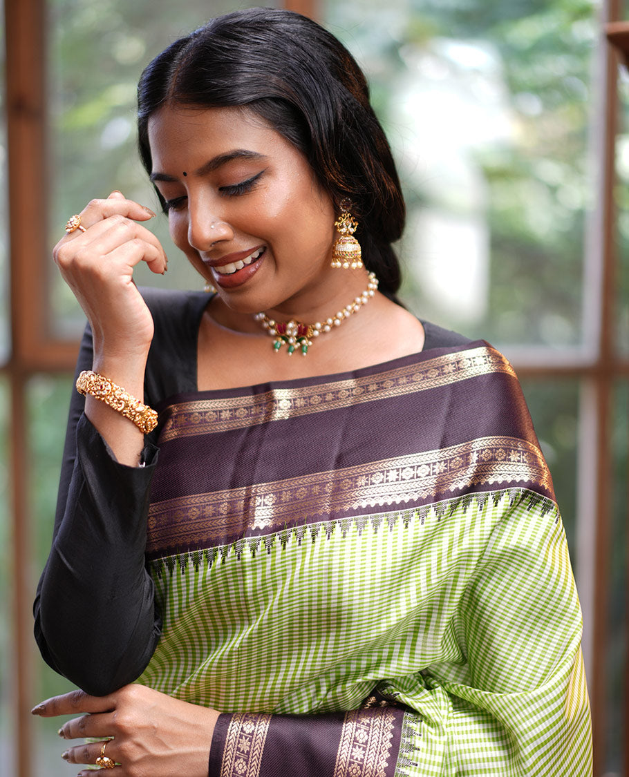 Green Vasundhara Silk Saree, Adorned with Kasa-Kasa-Style Checks, Complemented by a Contrast Rettai Pettu Border of Thazampoo Rekku, Salngai, Banaras, Kathir, Kamalam, and Star Designs, Gleaming Zari-Decked-Up Pallu and Paired with a Contrast Blouse