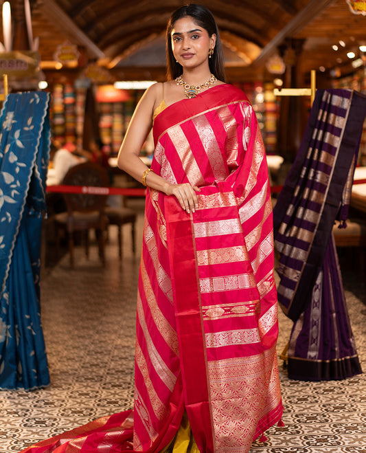 Rani Pink Dupion Silk Saree, Richly Features Vertically Woven Traditional Patterns in Zari, Complemented by Contrast Zari Satin Border, Rich Pallu, and Paired with a Matching Blouse