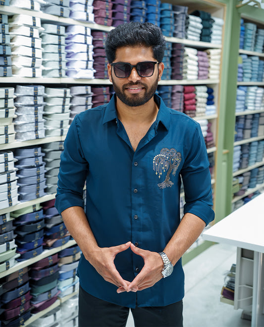 Peacock Blue Poly Blended Party Wear Shirt, Decorated with Tree-Motif Embroidery, Featuring a Spread Collar, Full Sleeves, Slim Fit, and Regular Length
