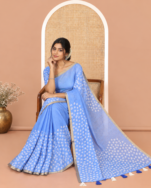 Blue Linen Cotton Saree Features Half-And-Half-Style Flower Motifs Print, a Piping Border, and a Matching Blouse