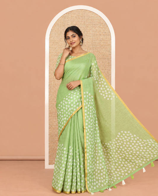 Green Linen Cotton Saree Features Half-And-Half-Style Flower Motifs Print, a Piping Border, and a Matching Blouse