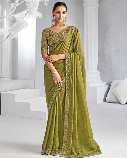 Green plain designer saree, scallop embroidered border, self-pallu, and a heavy embroidered blouse