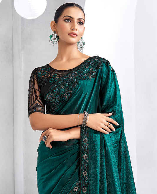 Peacock green plain designer saree, scallop intricately embroidered border, and self-pallu