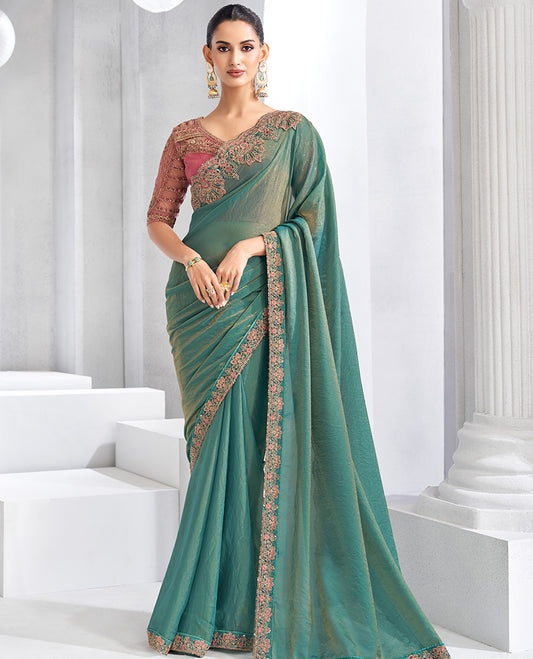 Green plain designer saree, contrast floral embroidered scallop border, and self-pallu