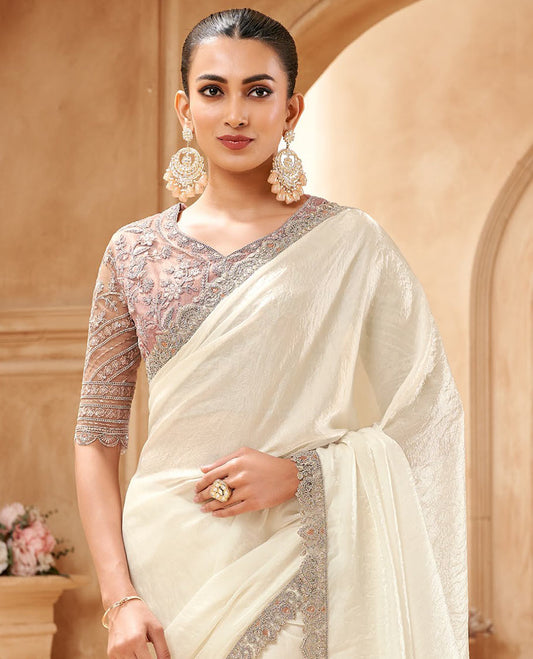 Cream crushed designer saree, scallop embroidered border, and embroidered blouse