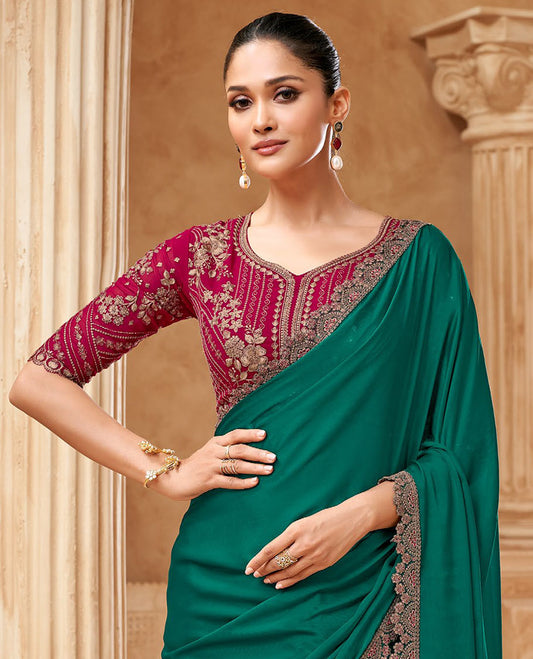 Bottle green plain designer saree, scallop embroidered border, and contrast embroidered blouse