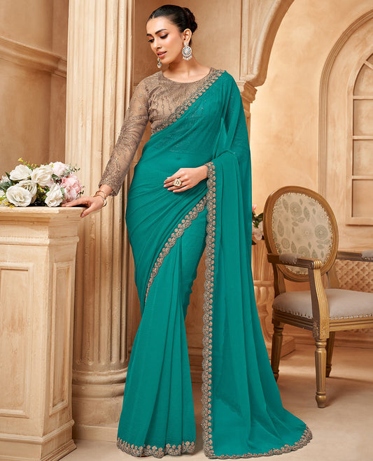 Blue plain designer saree, scallop embroidered border, and contrast embroidered blouse